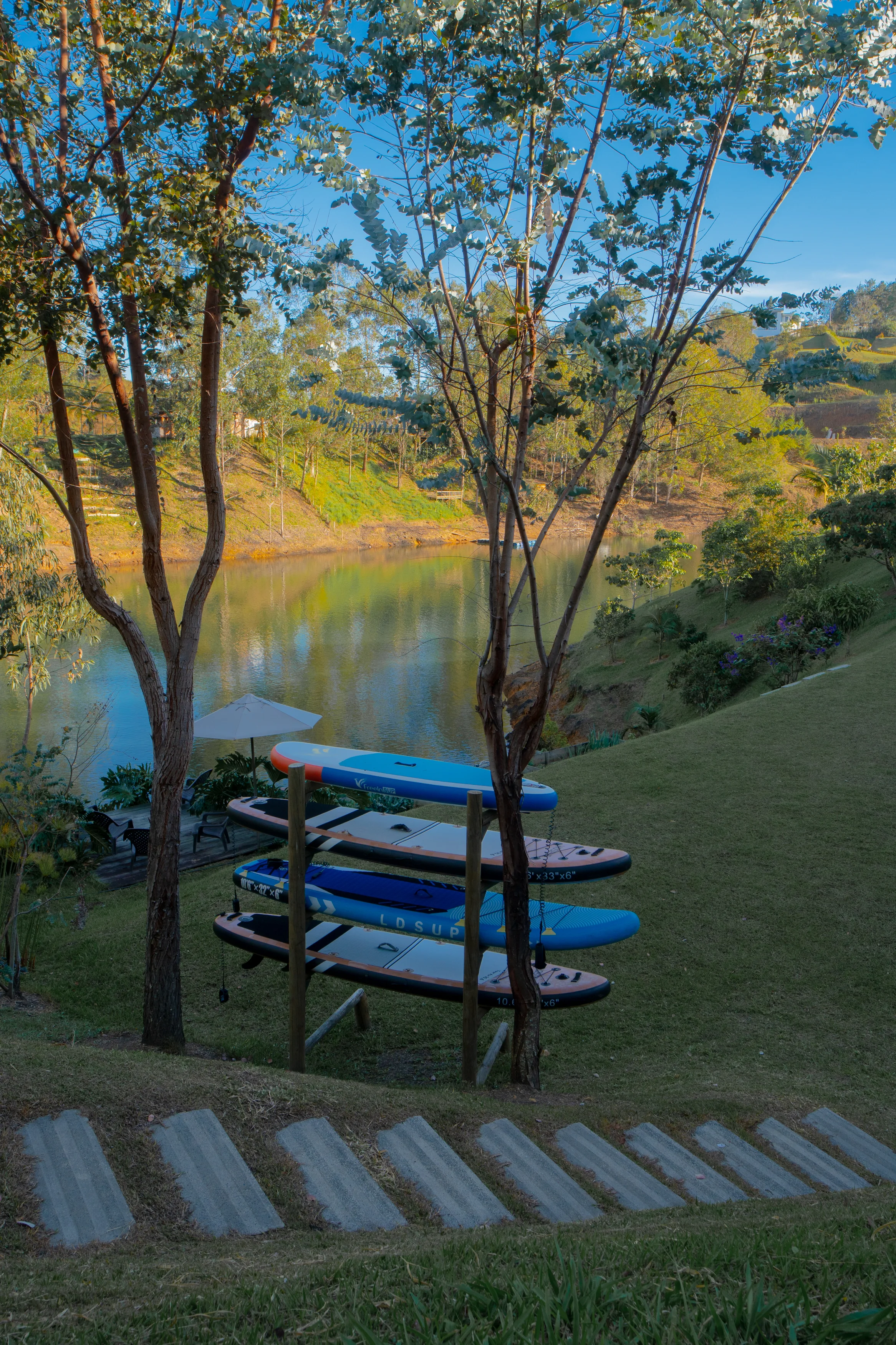 Kayaks and paddleboards by the lake
