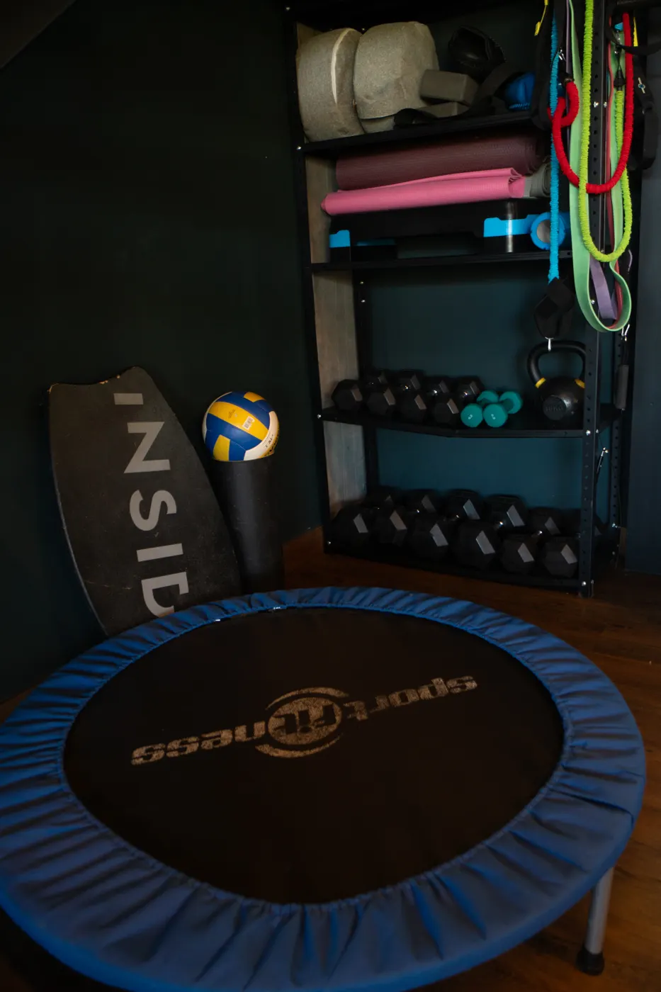Private fitness corner with trampoline and free weights