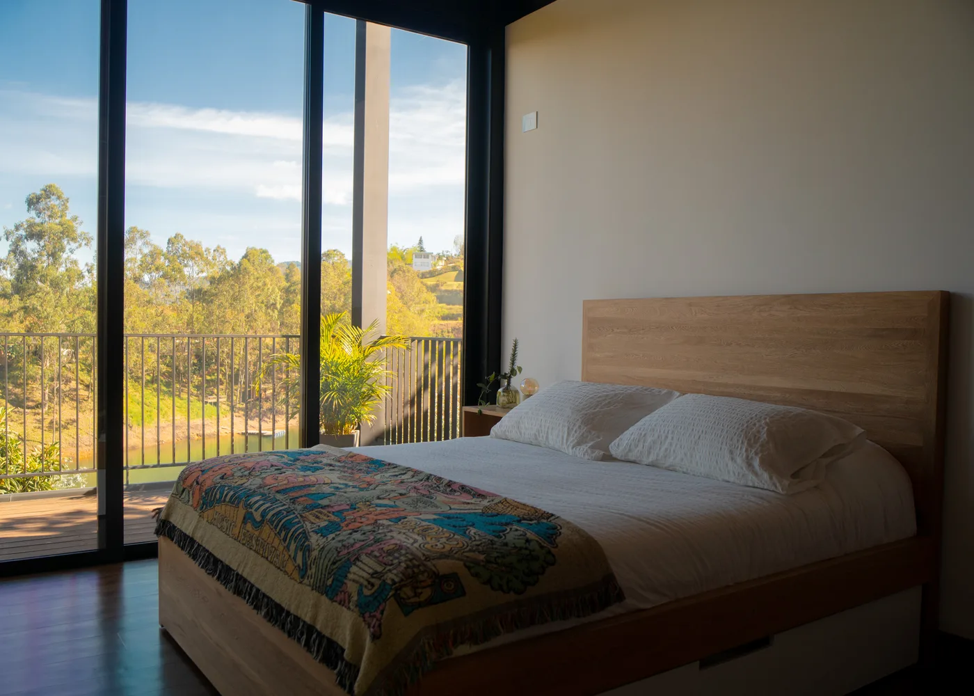 Second master suite bedroom with balcony and lake views